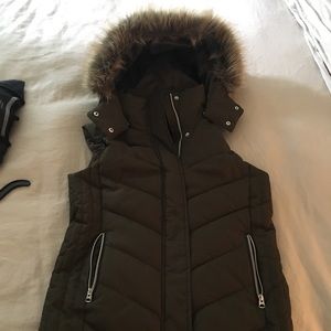 Green puffy vest with fur hood